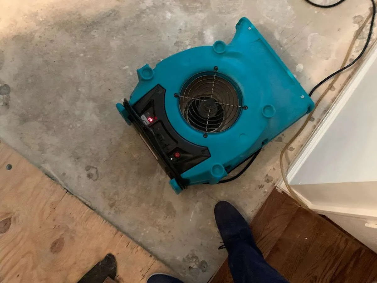 Air mover drying subfloor during Leak Detection & Repair in Lancaster